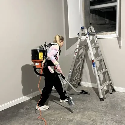 A professional cleaner working in a home